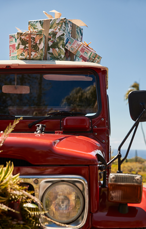 Image of red truck with gifts on top