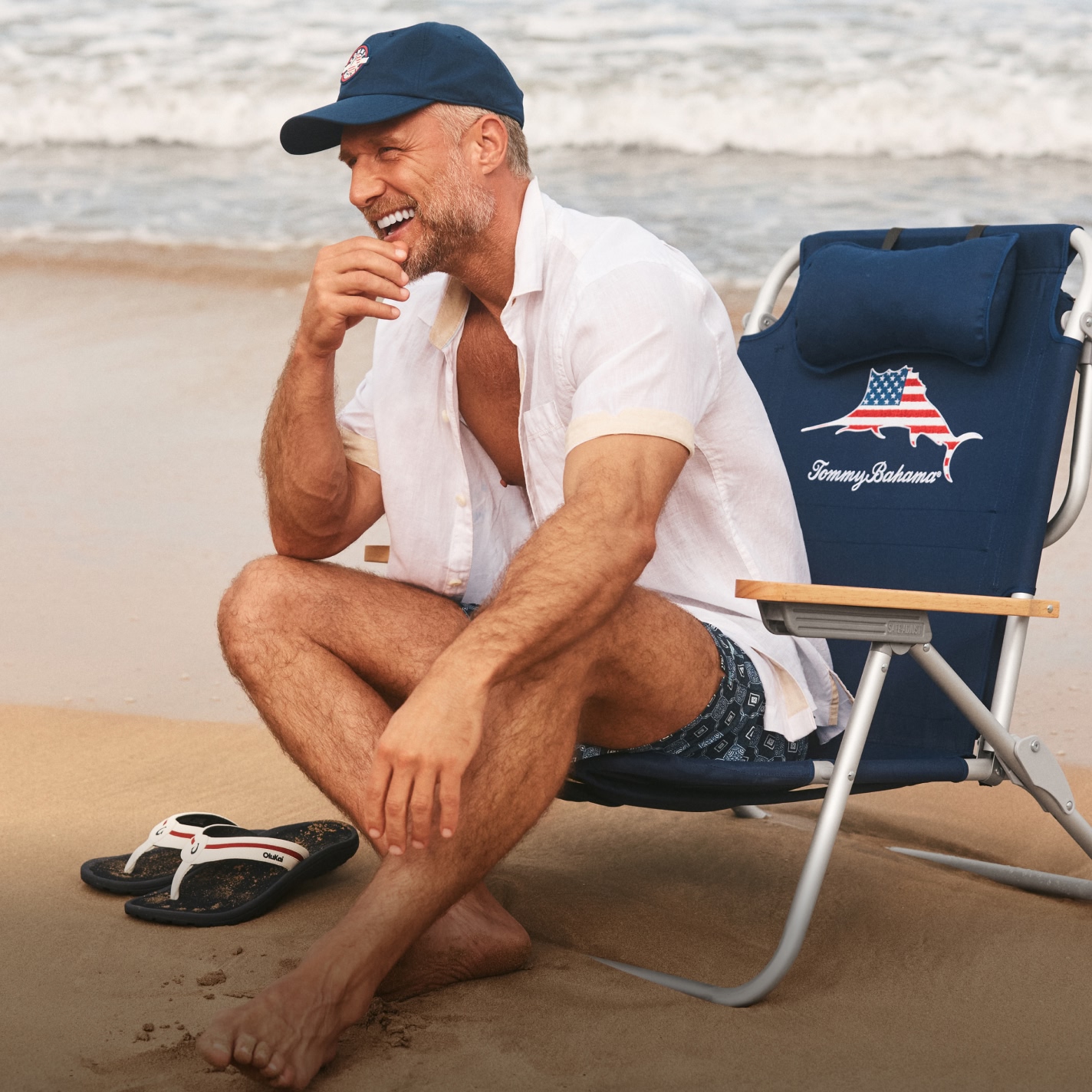 Image of man sitting on Tommy Bahama beach chair