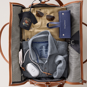Tommy Bahama duffle bag filled with packing items
