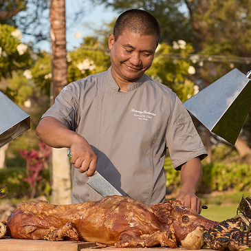Chef Cutting Into Kalua Pork