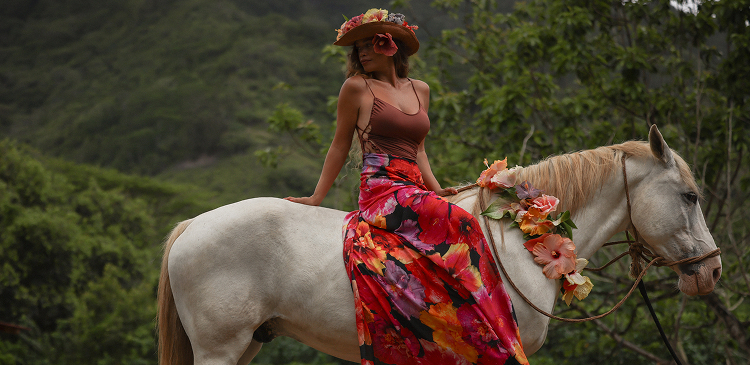 Pamakane Pico Riding A Horse Covered In Leis