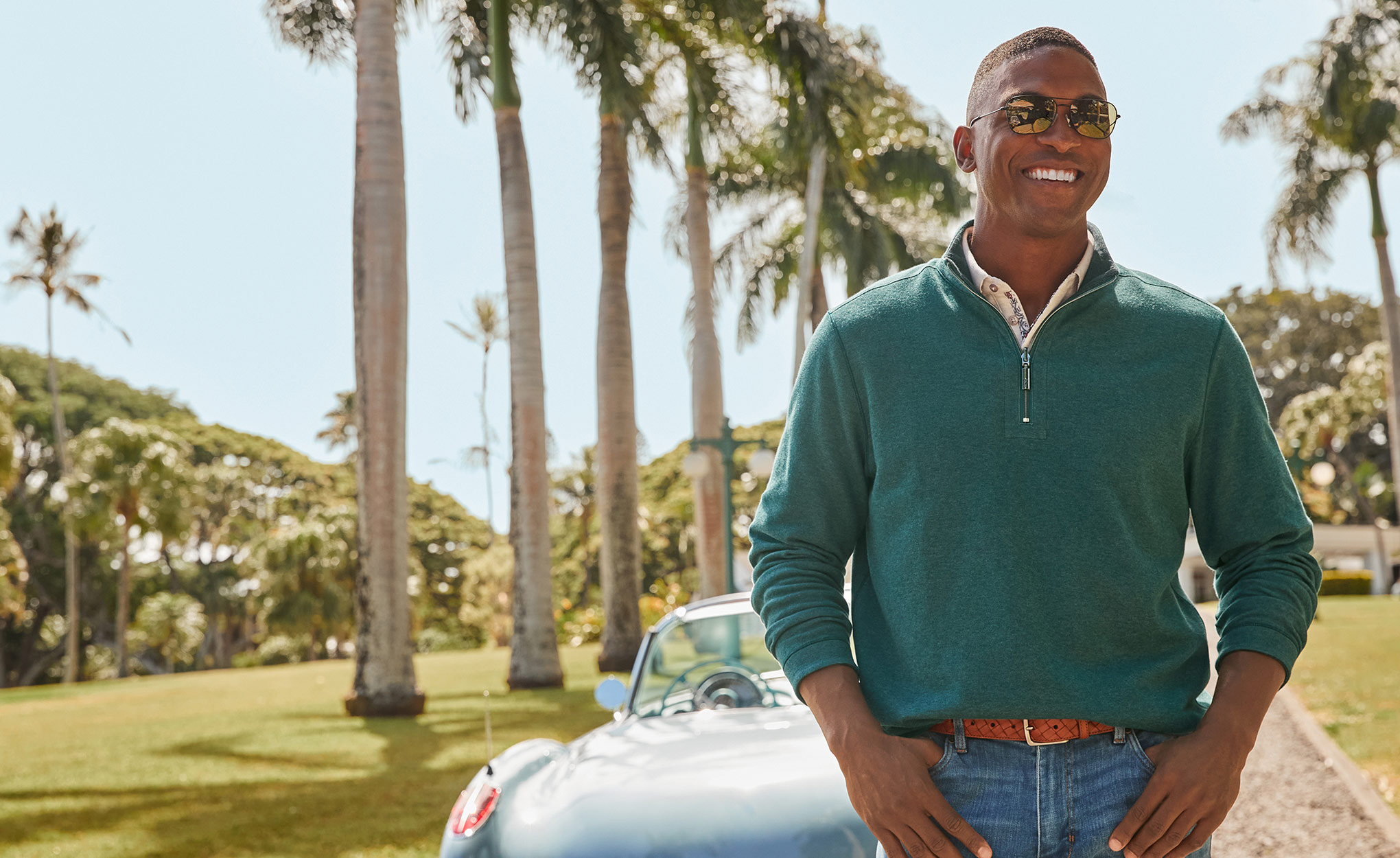 Man Wearing Green Flipview Half-Zip