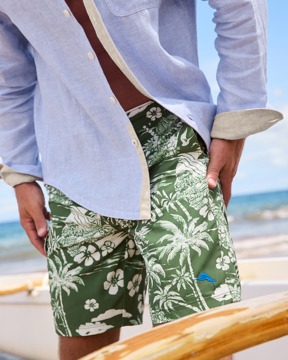 Man Wearing Green Tropical Boardshorts