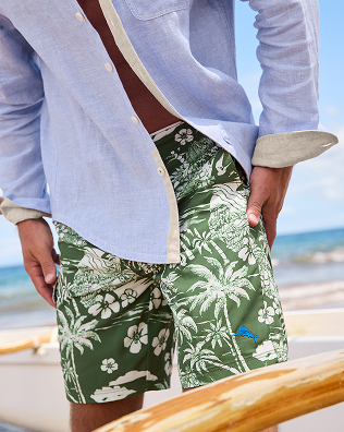 Man Wearing Green Tropical Boardshorts